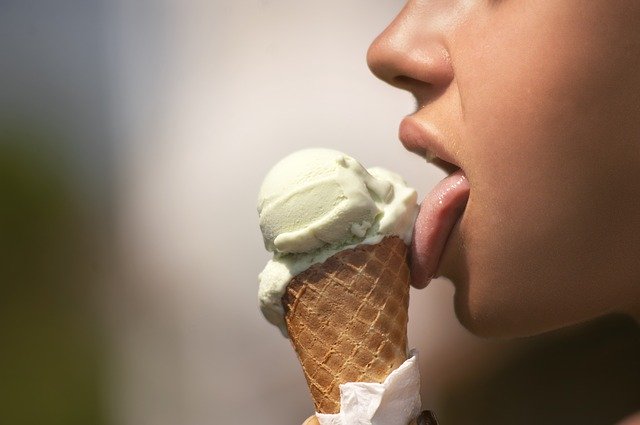 person licking ice cream