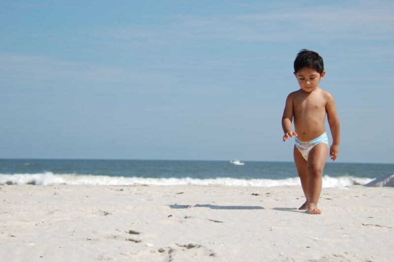baby walking on the anna maria island beach